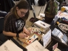 WINDSOR, Ont. (14/02/16) – Artist Eliana Clemente is pictured painting a Valentine’s Day card while working at the 2016 Comic Book Syndicon at the St. Clair College Centre for the Arts in Windsor on Sunday, Feb. 14, 2016. Photo by Justin Prince