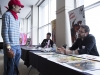 WINDSOR, Ont. (14/02/16) – Award-nominated comic book artist Yanick Paquette (right) talks to a patron at the 2016 Comic Book Syndicon at the St. Clair College Centre for the Arts in Windsor on Sunday, Feb. 14, 2016. Paquette has been working in the industry for more than 20 years for publishing companies such as Marvel Comics and DC Comics. Some of his work includes the Ultimate X-Men, Wonder Woman and Swamp Thing comic series. Photo by Justin Prince